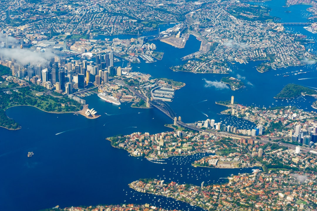 an aerial view of a city and a body of water