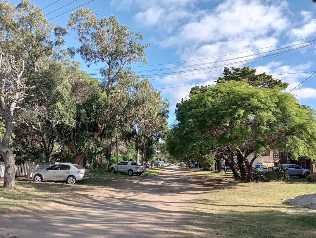 a street with cars parked on the side of it